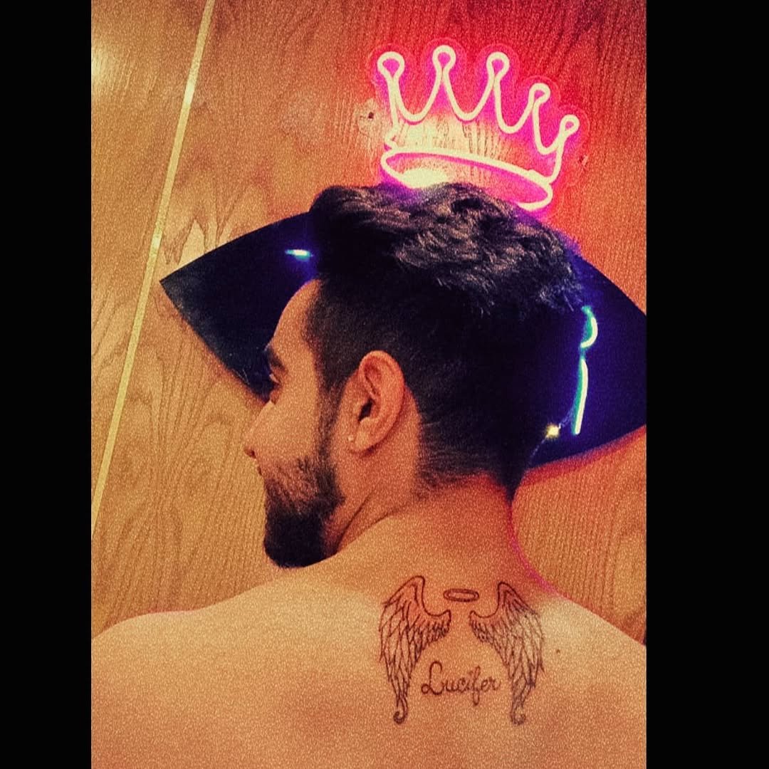 Arsal ch with angel wings neck tattoo